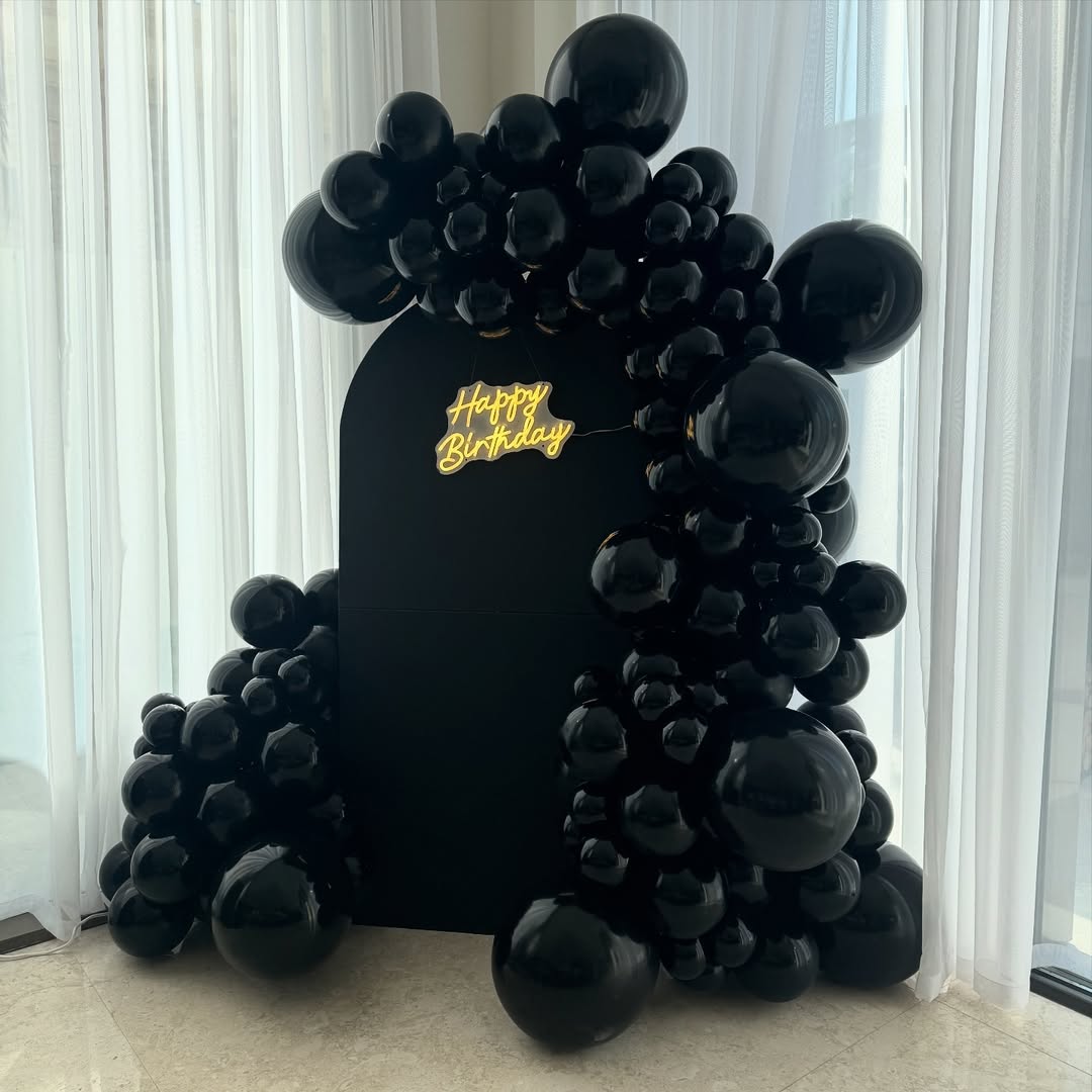 All-Black Matte Arch with Glossy Balloon Garland & Neon Sign