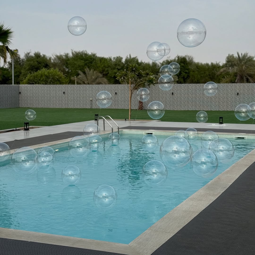 Pool Side Gender Reveal Mystery Box Setup with Floating Pool Balloons
