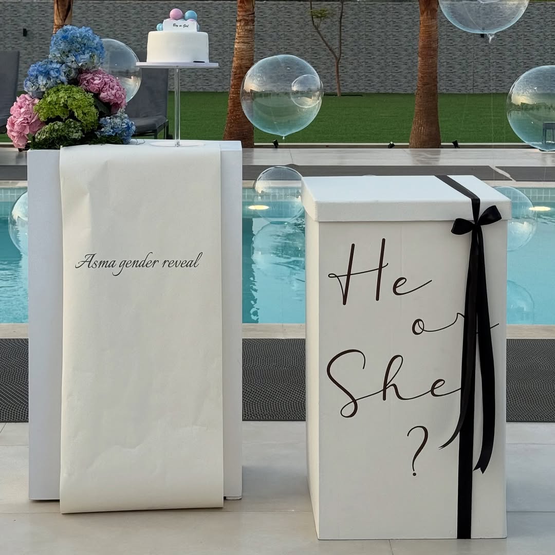 Pool Side Gender Reveal Mystery Box Setup with Floating Pool Balloons
