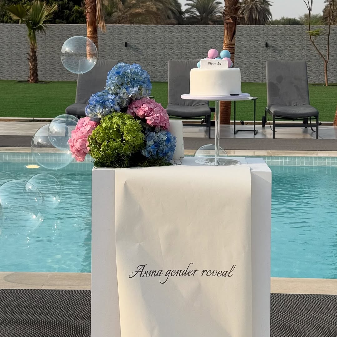 Pool Side Gender Reveal Mystery Box Setup with Floating Pool Balloons